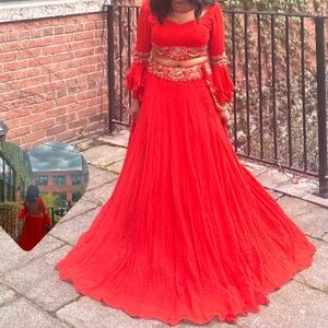 Orange red lehenga with beautiful details